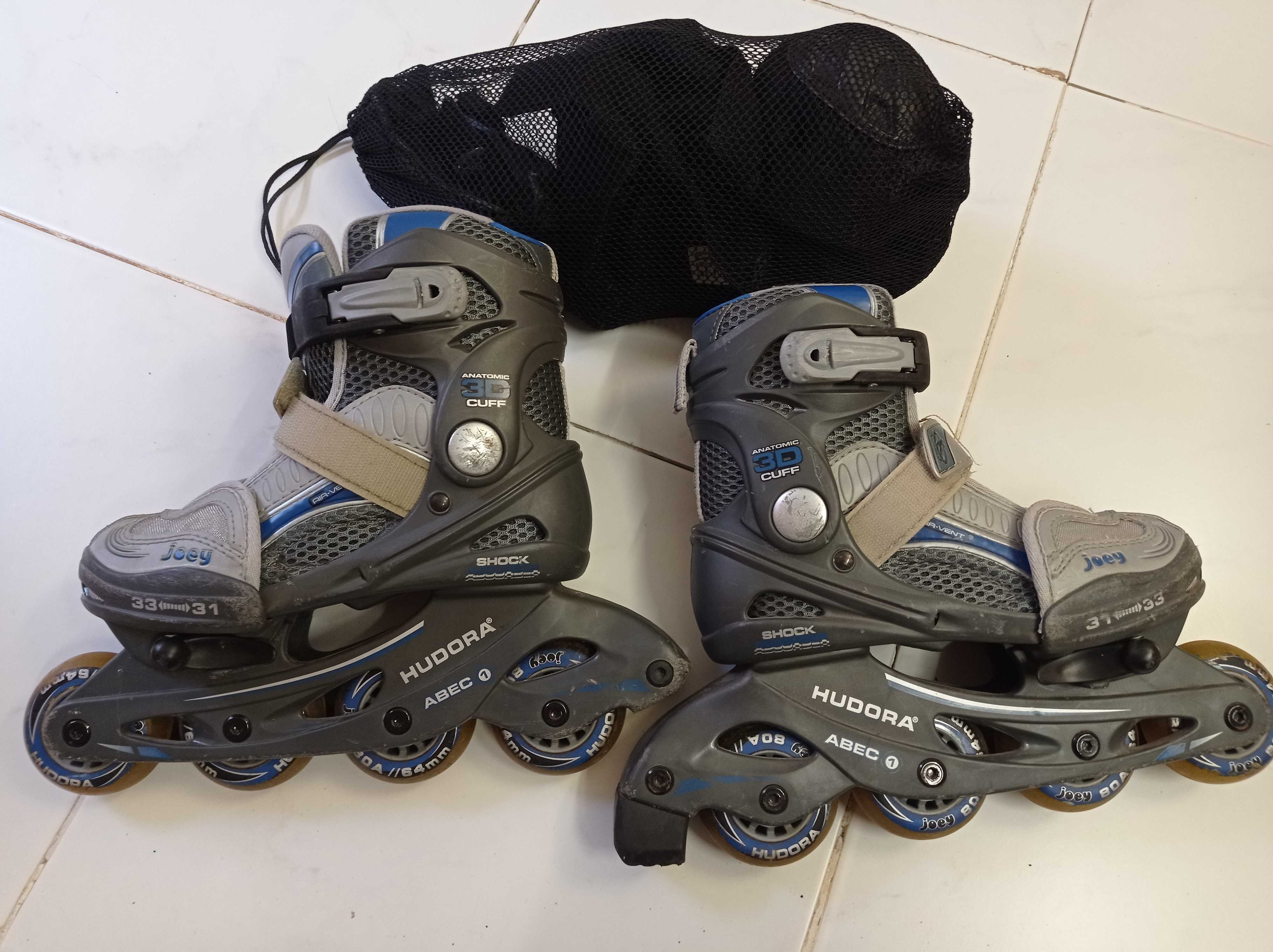 Patins em linha (31-33) usados + proteção