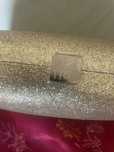 Pochet marca Helena Rubenstein  original cor dourada