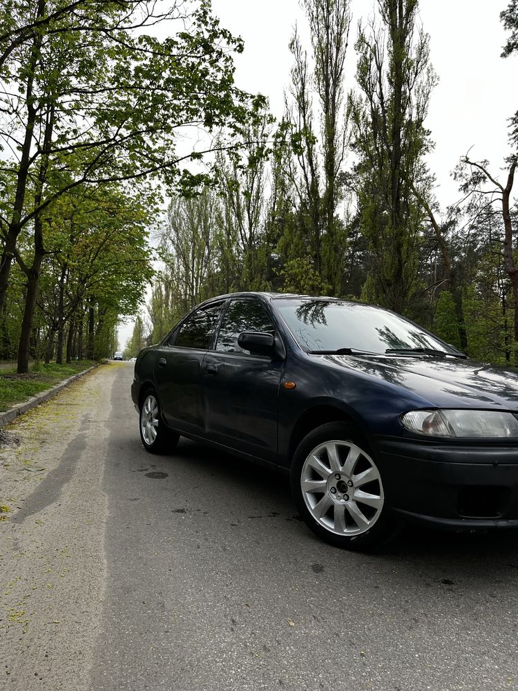 Mazda 323 1997 сел уехал