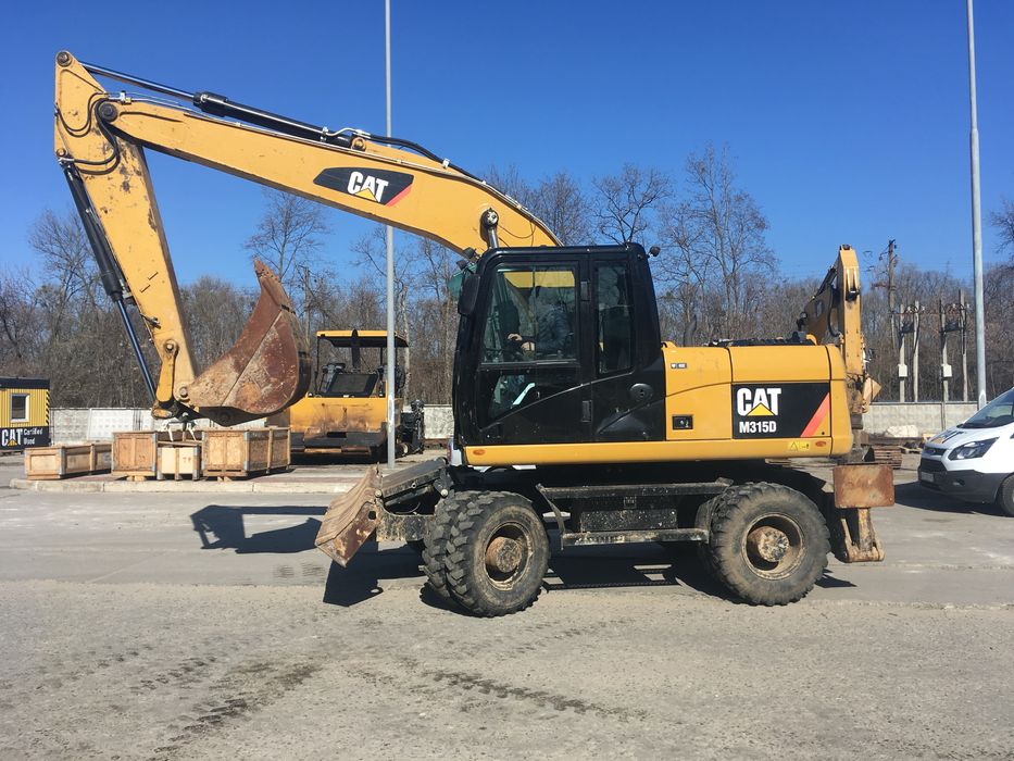 Колісний екскаватор CAT 315 Atlas