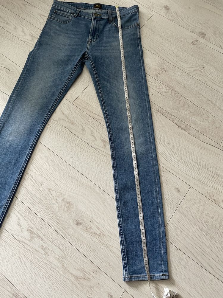 Niebieskie bawełniane meskie spodnie jeansy skinny Lee W30 L34