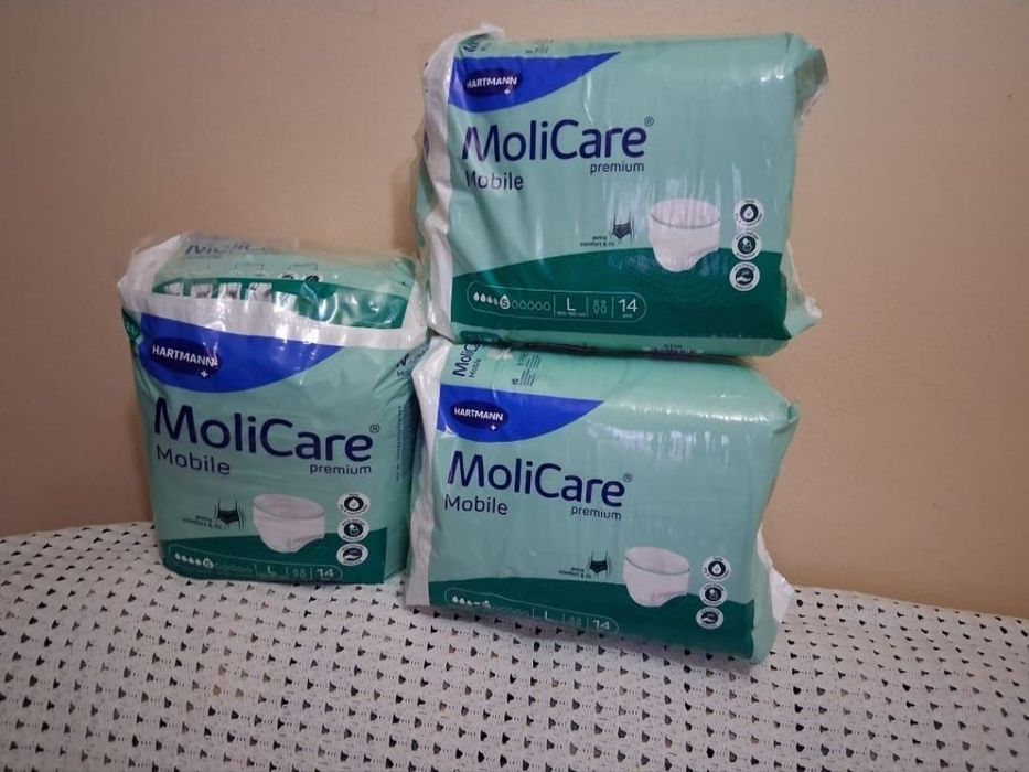 Vendo 3 embalagens de fraldas molicare