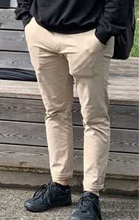 Męskie spodnie materiałowe eleganckie beżowe brązowe 31