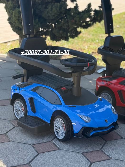 Толокар машинка с ручкой поворотной кожаное сидение музыка Новый