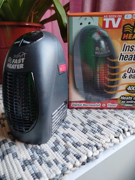 Mini aquecedor de tomada