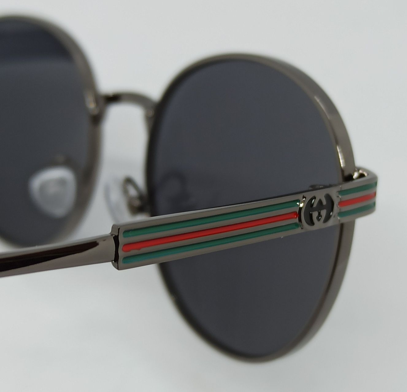 Gucci очки унисекс черные однотонные в сером металле округлые