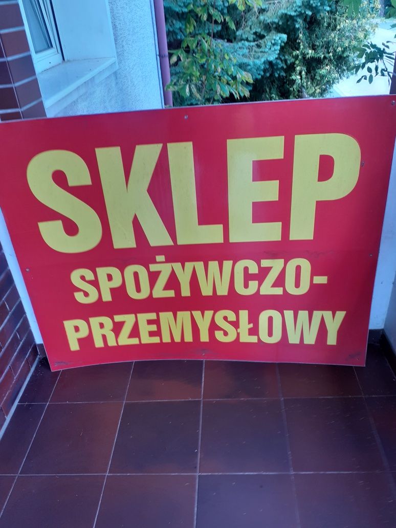 Szyld reklamowy na nierdzewnej bl.