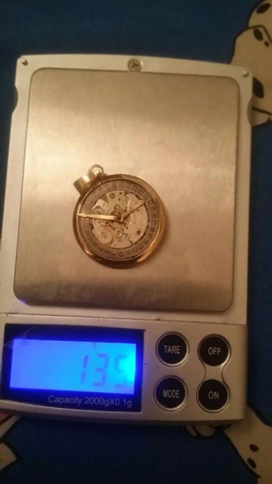 Pendente em ouro 18kt,c/ máquina swiss nade,peso total ,13.6 gr,único