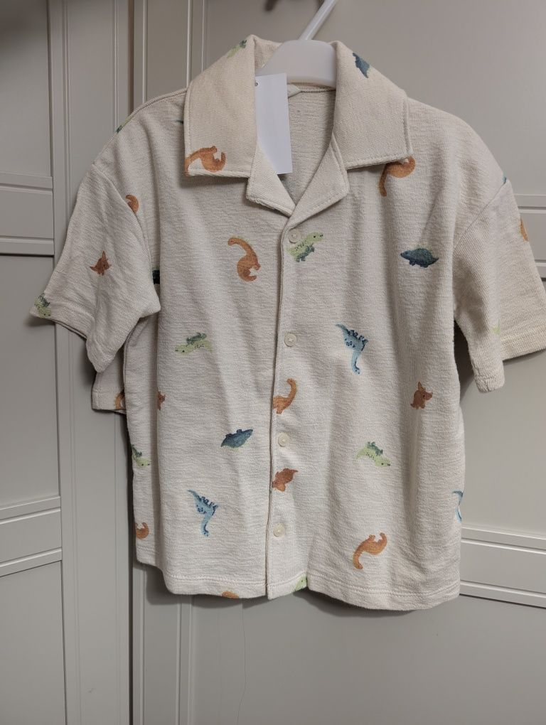 Cudny komplet H&M 104 kremowy dinozaury