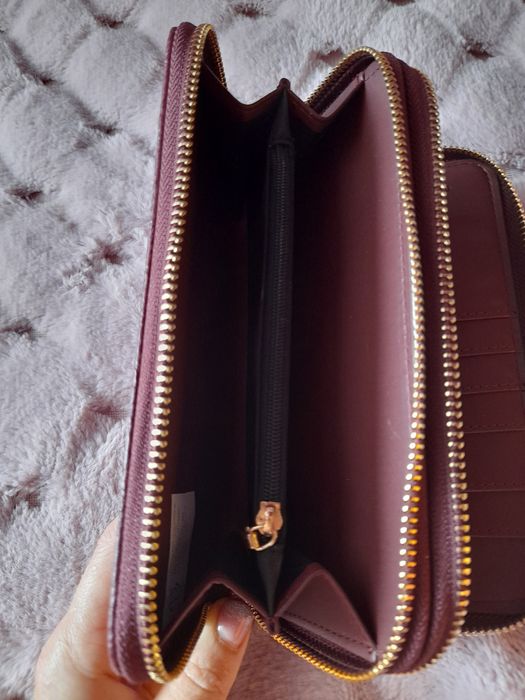 Гаманці  .  . . .