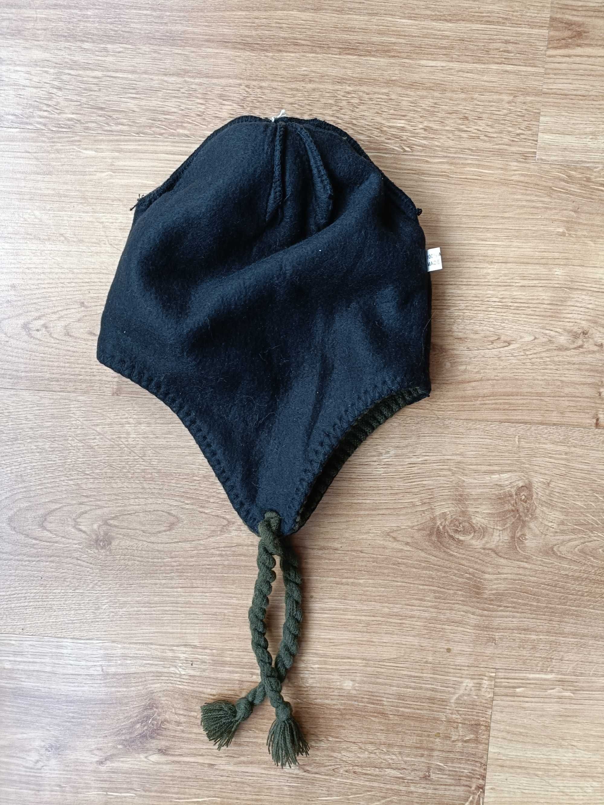 Nowa czapka zimowa dla dziecka szerokości 26,6 cm.