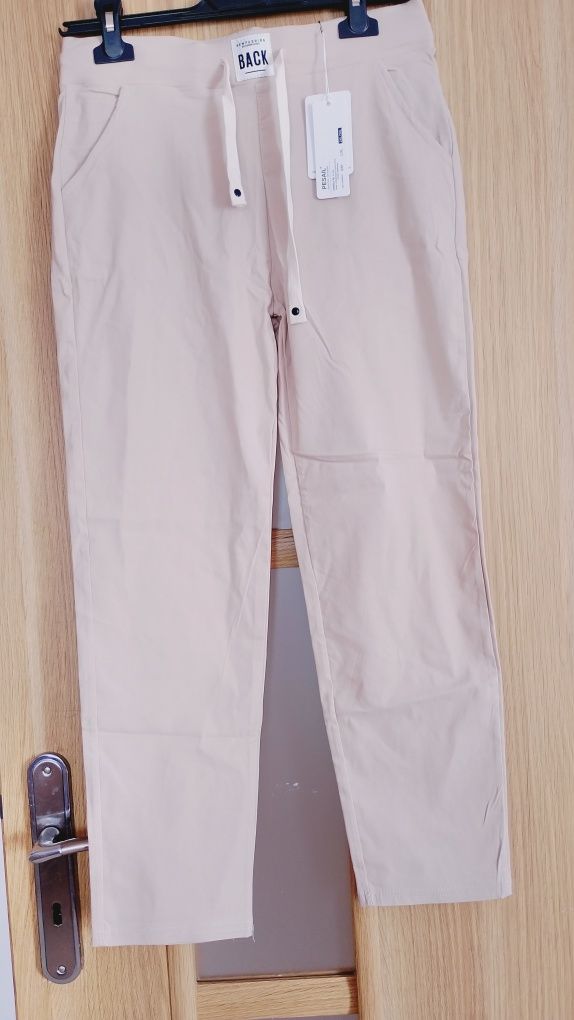 Nowe beżowe spodnie tak zwane gumy, rozm L lXL