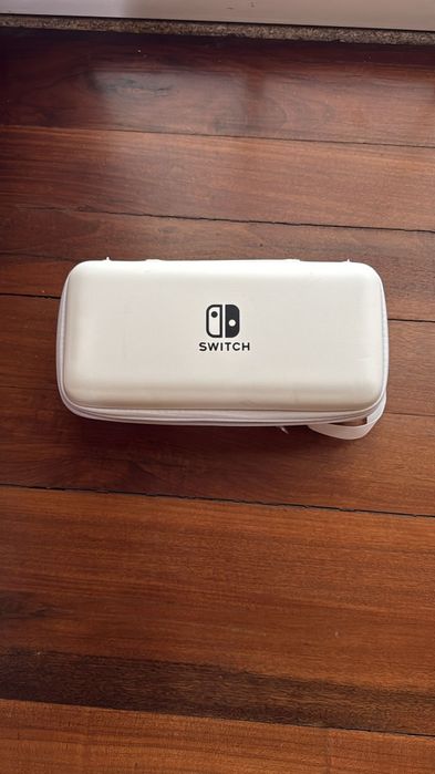 Nintendo switch + jogo + bolsas + película + cartão de memoria