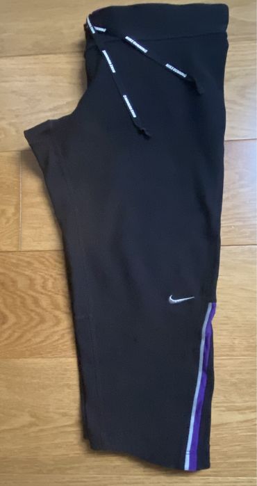Damskie legginsy getry spodenki 3/4 sportowe do biegania Nike roz. S