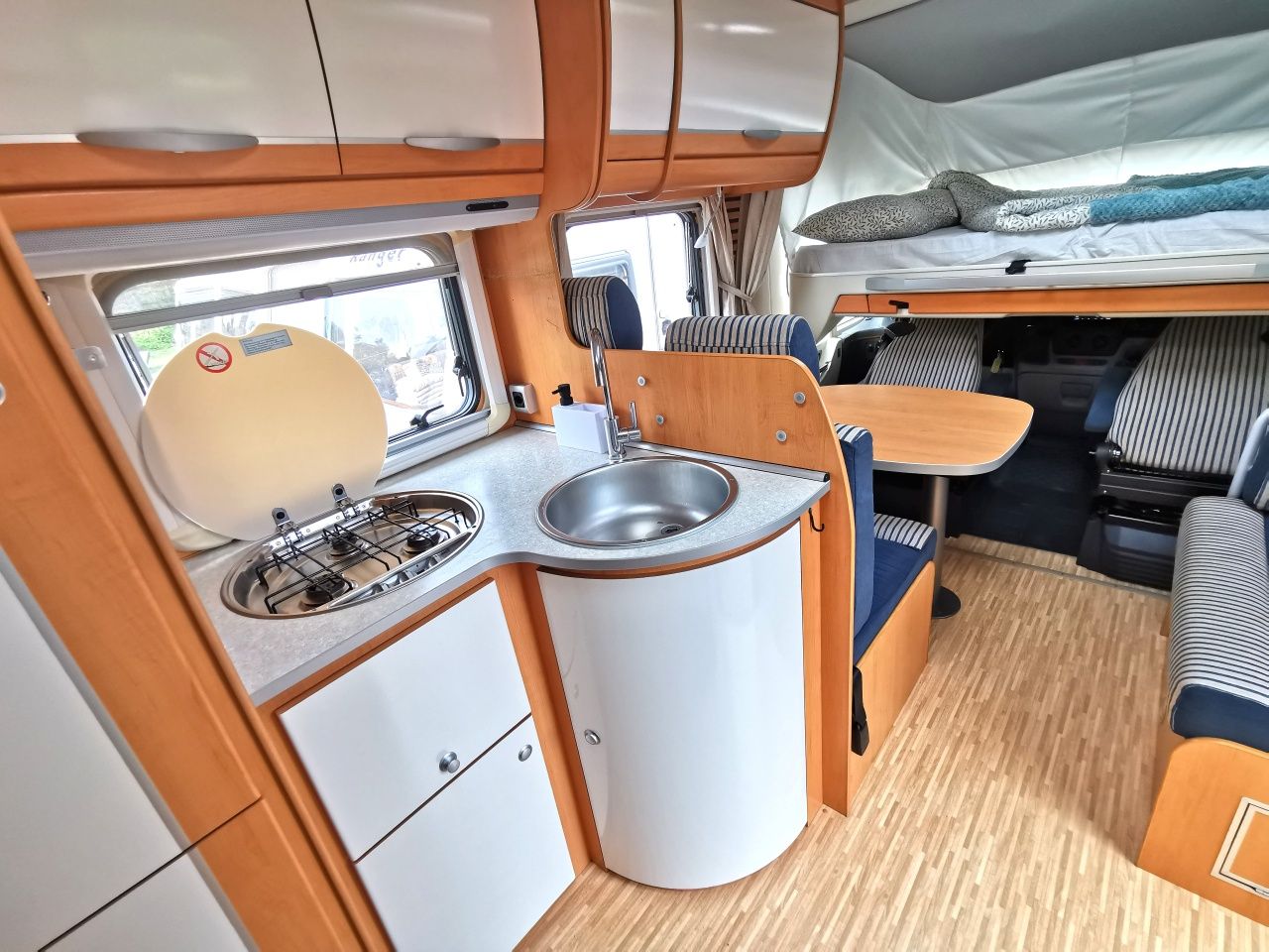 Wynajem kamper HYMER integra, Sierpień bez limitu kilometrów 4-osobowy