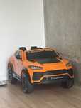 Lamborghini Squadra Corse оранжевий дитячий електроавтомобіль
