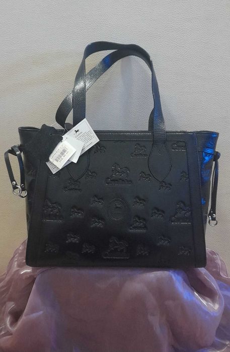 mala em pele nova com etiqueta de marca Cavalinho