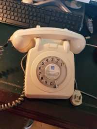Telefones antigo cinzento, branco e preto de disco
