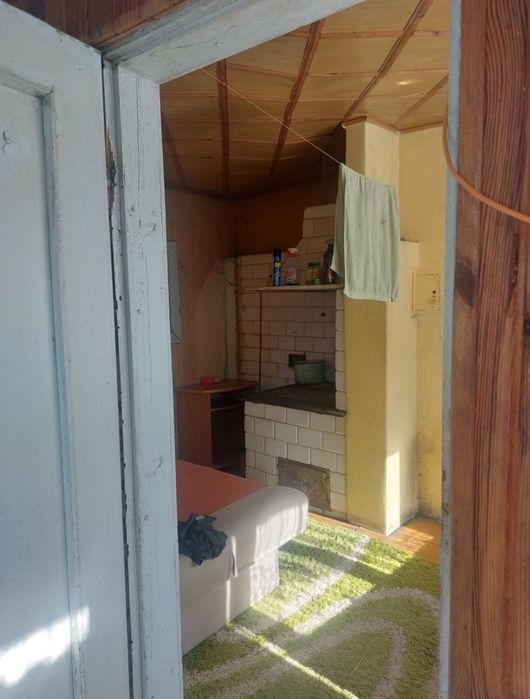 Dom drewniany z murowaną przybudowka.