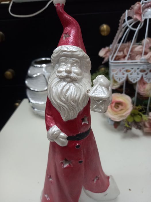 Pai natal em louça  que dá luz