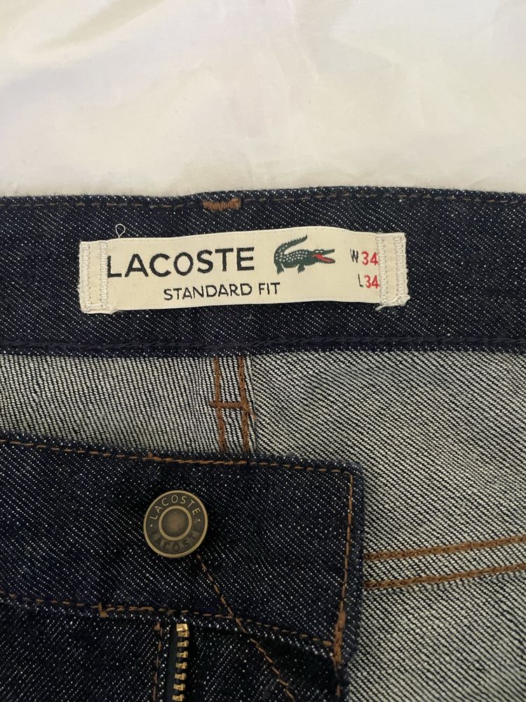 Джинси Lacoste.