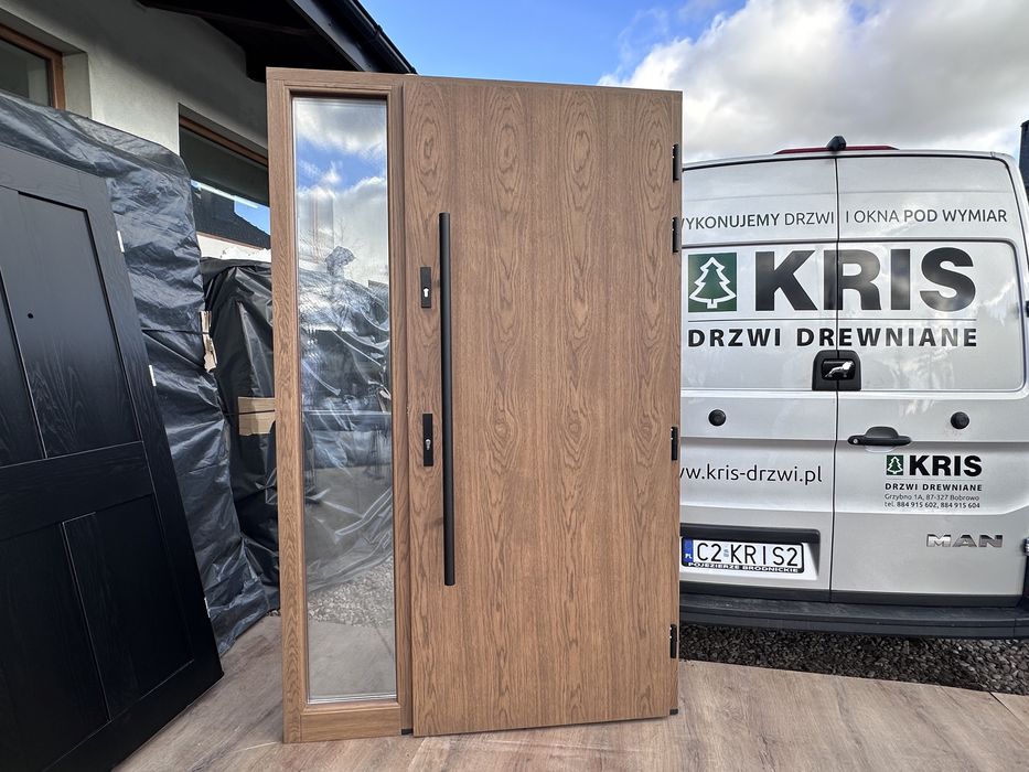 Drzwi zewnętrzne drewniane dębowe z doświetlem i antabą montaz Polska