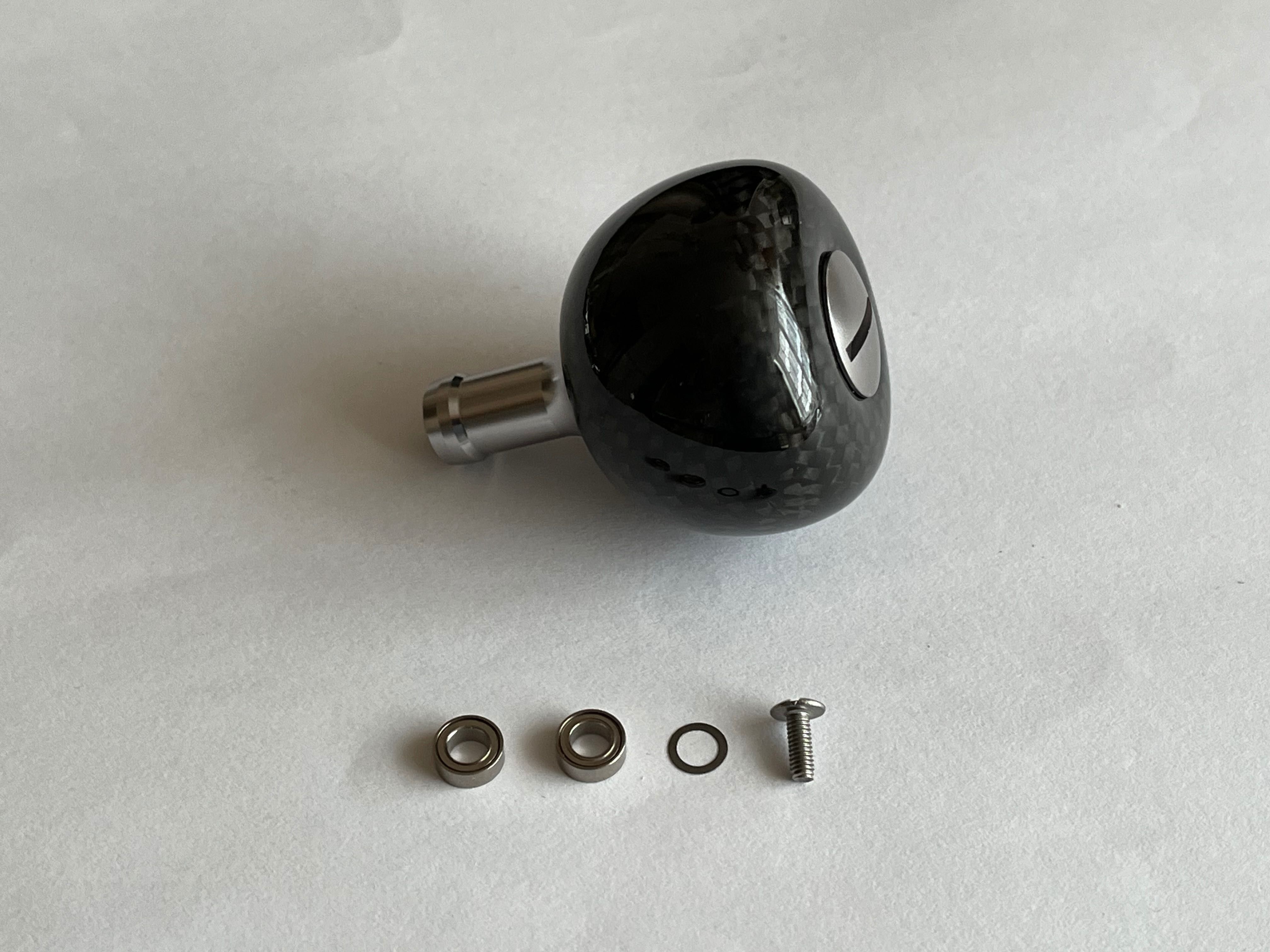 Knob tuningowy z włókna węglowego do kołowrotków Shimano, Daiwa