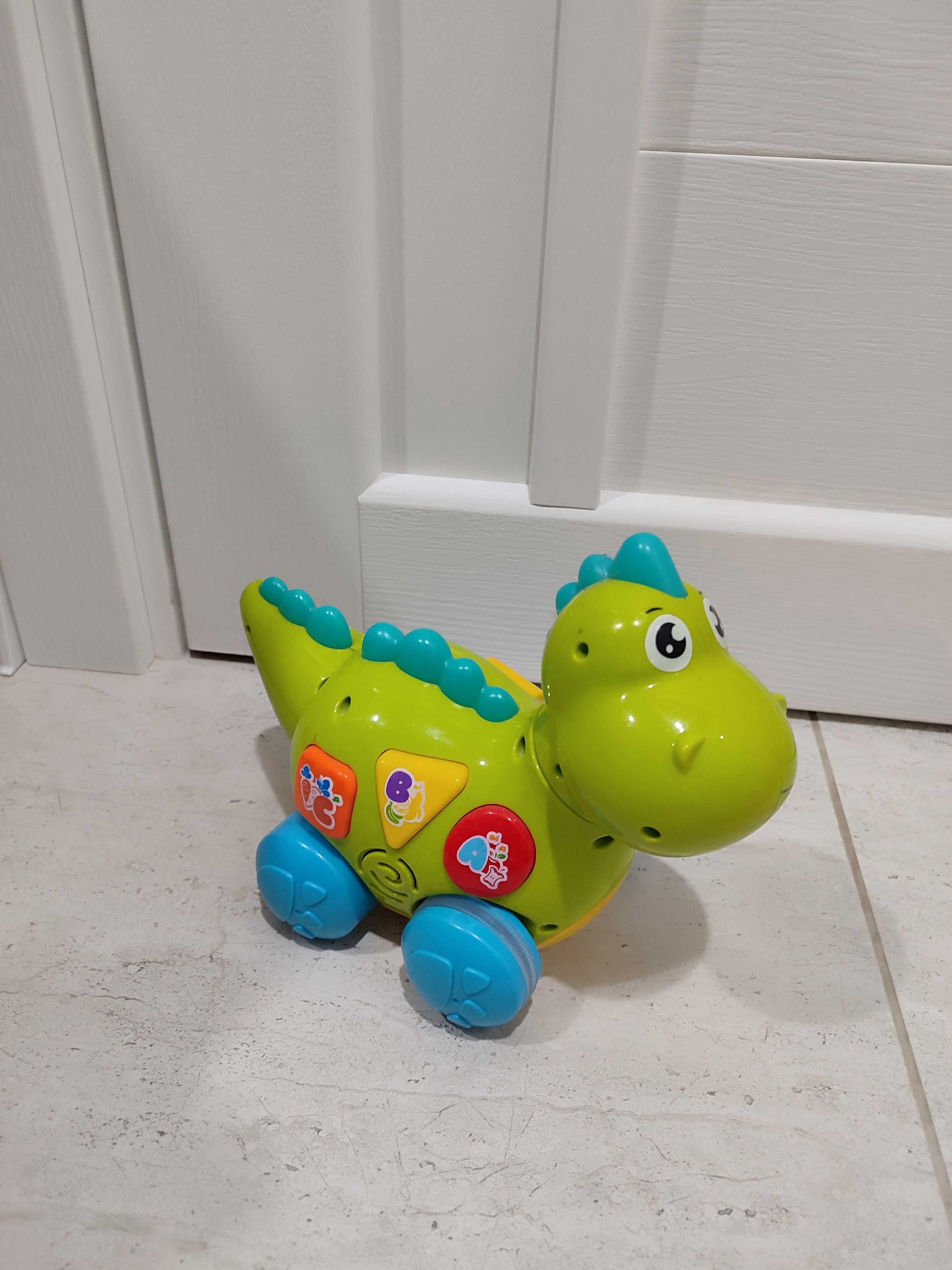 Музична іграшка Динозаврик "Huile Toys" їздить, розмовляє, співає