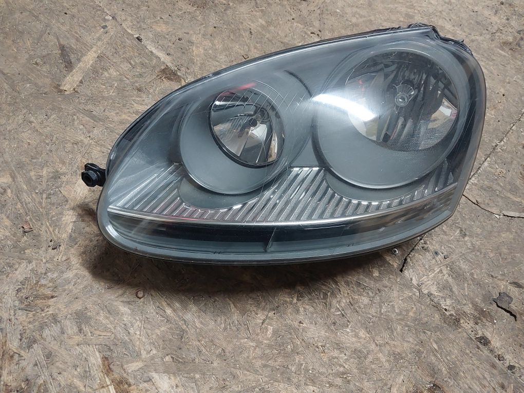 Lampa reflektor lewy vw golf v jetta golf plus hella