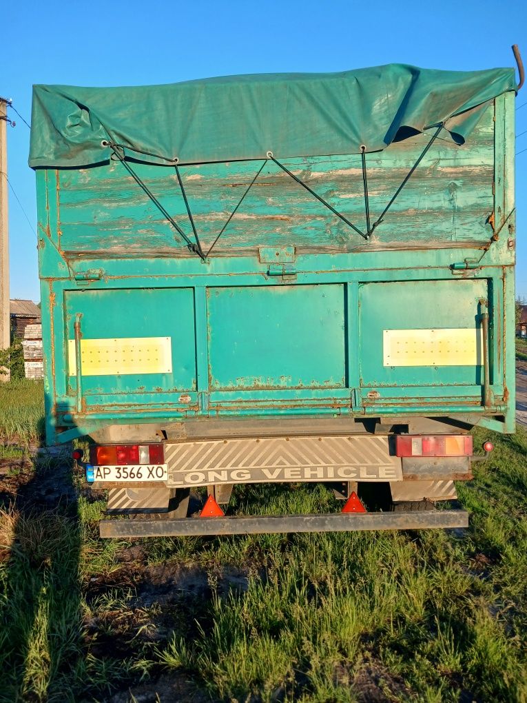Прицеп,зерновоз ,бортовий,німецкий,практично новий.