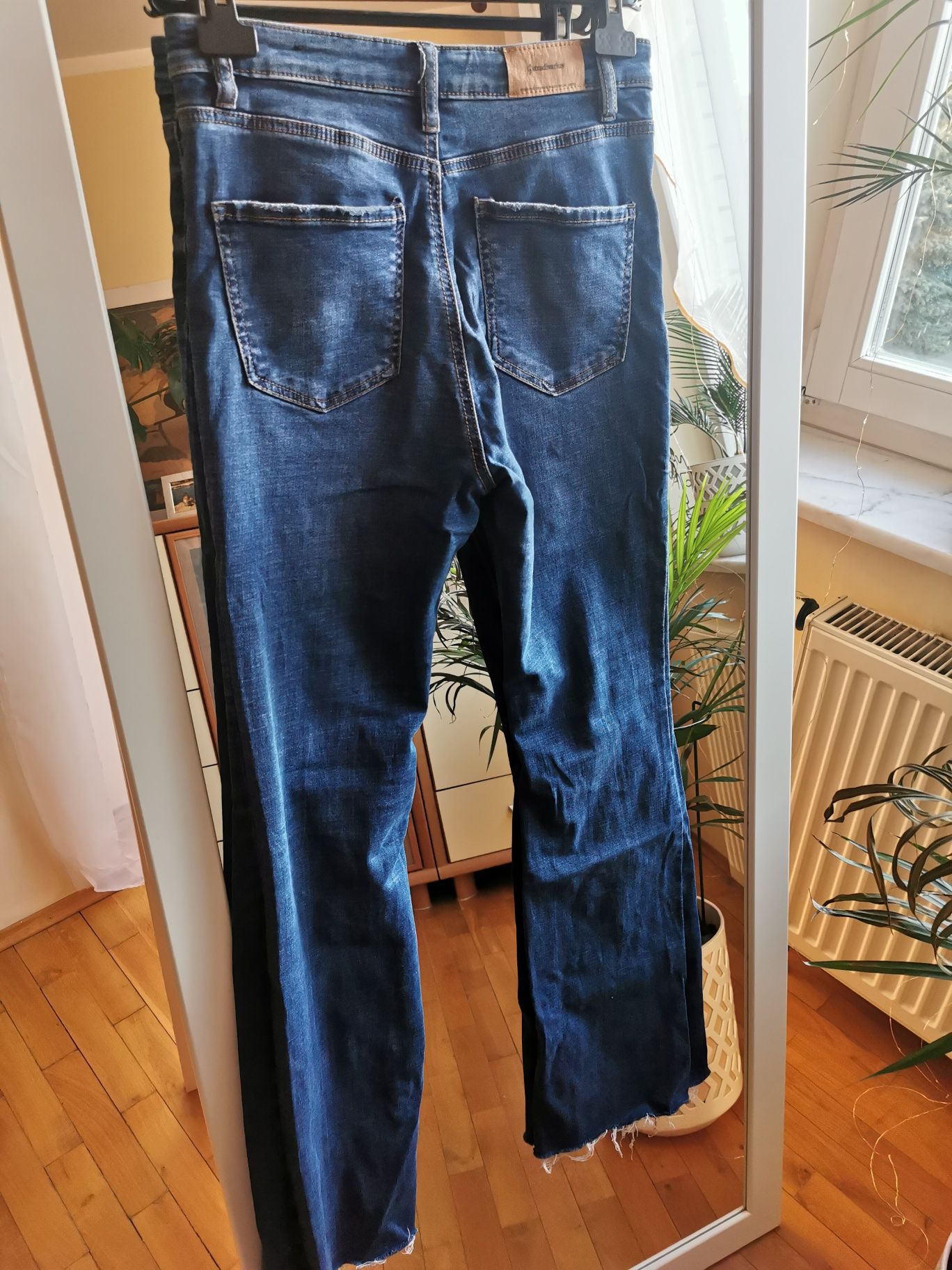 Niebieskie spodnie dzwony flare jeansowe split rozcięcie high waist 40