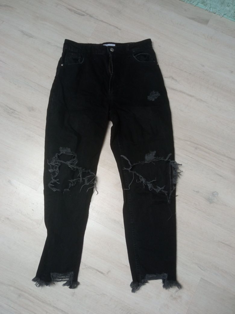 Spodnie jeansowe damskie czarne z dziurami