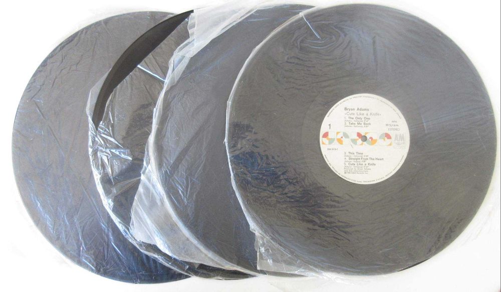 BRYAN ADAMS - Caixa Em Lata Com 4 LP's