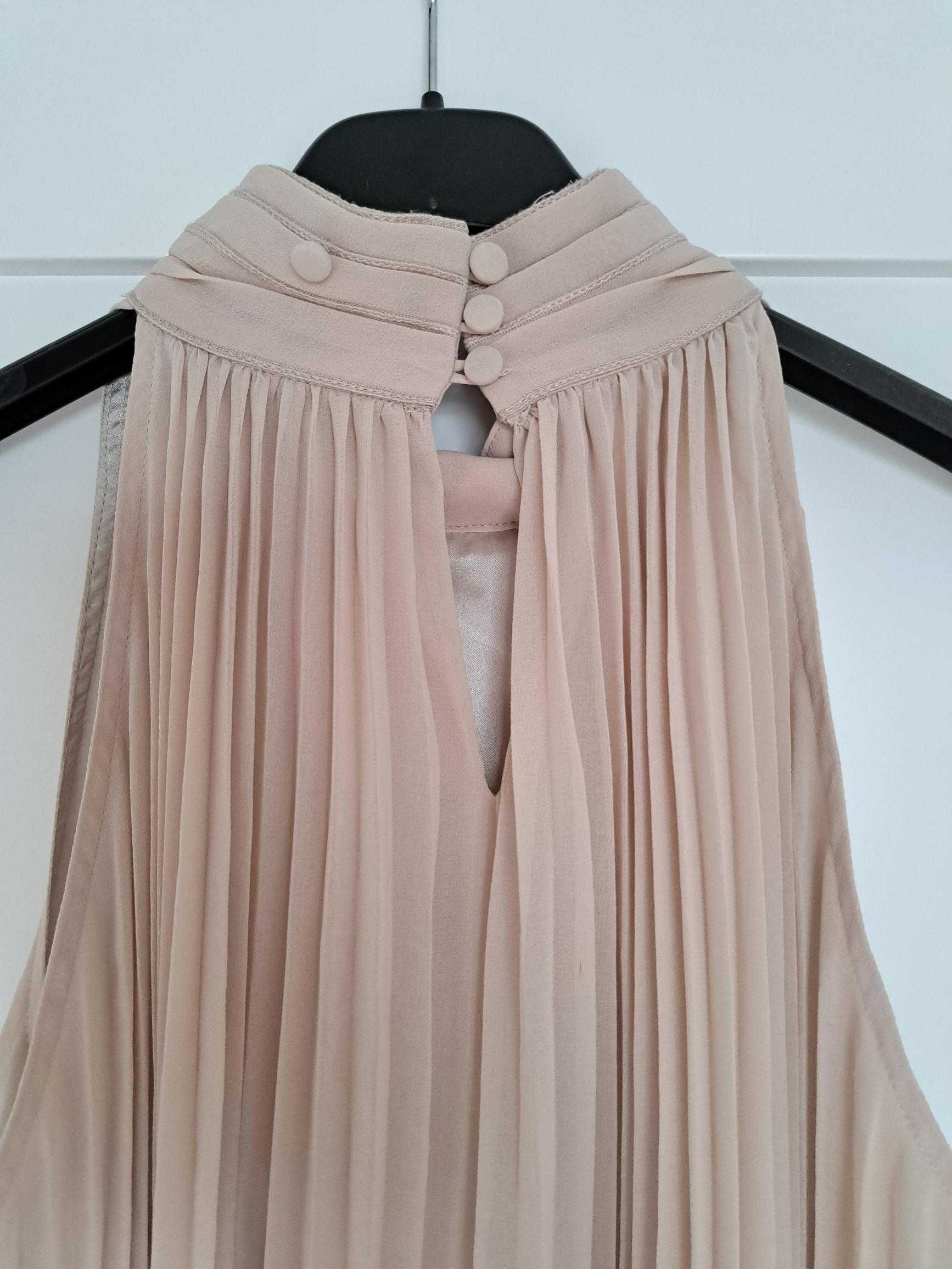 Elegancka sukienka midi z dekoltem typu halter