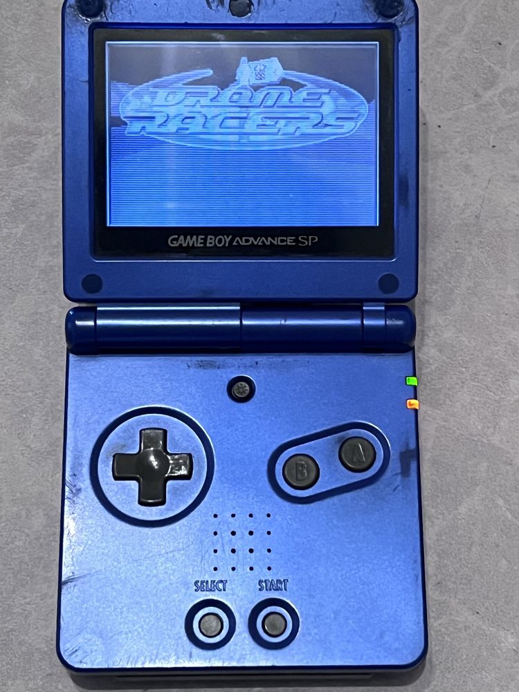 Gameboy advance sp azul com carregador e 4 jogos