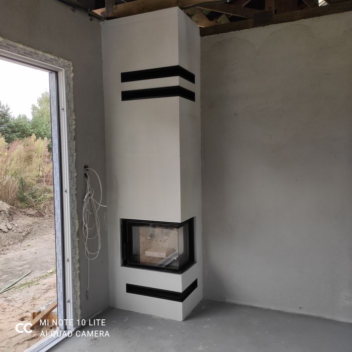 Kominek z szybą boczną narożny kominki