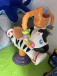 Skoczek zebra fisher price
