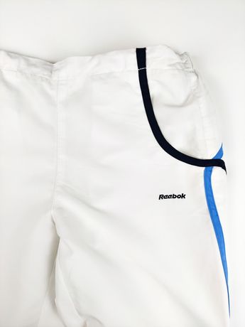 Białe spodnie dresowe damskie Reebok rozmiar S sportowe ortalionowe