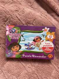 Puzzle dora poznaje świat