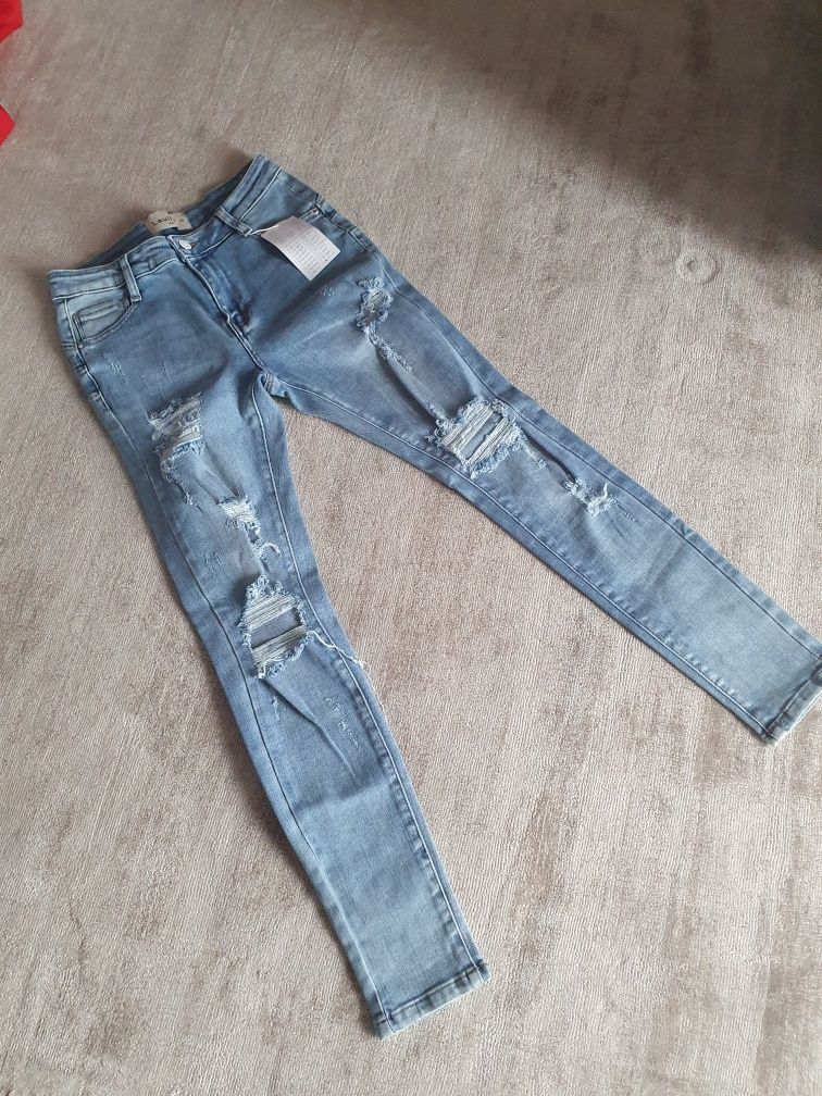 Spodnie jeansowe Laulia z przetarciami i dziurami r.38