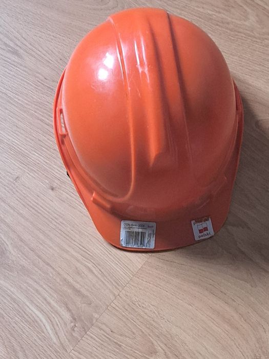 Kask budowlany pomarańczowy z uchwytem regulowany