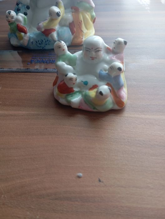 Buda de fertilidade em porcelana