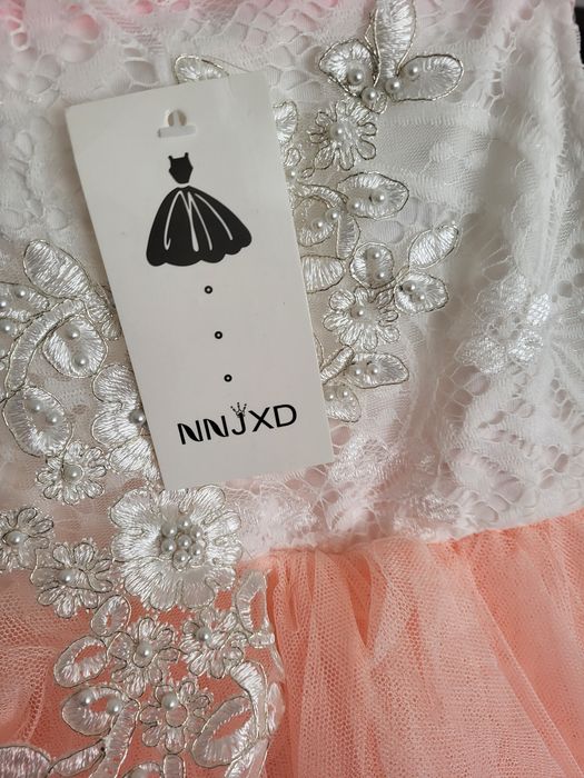 Elegancka sukienka bialo-brzoskwiniowa dla dziewczynki