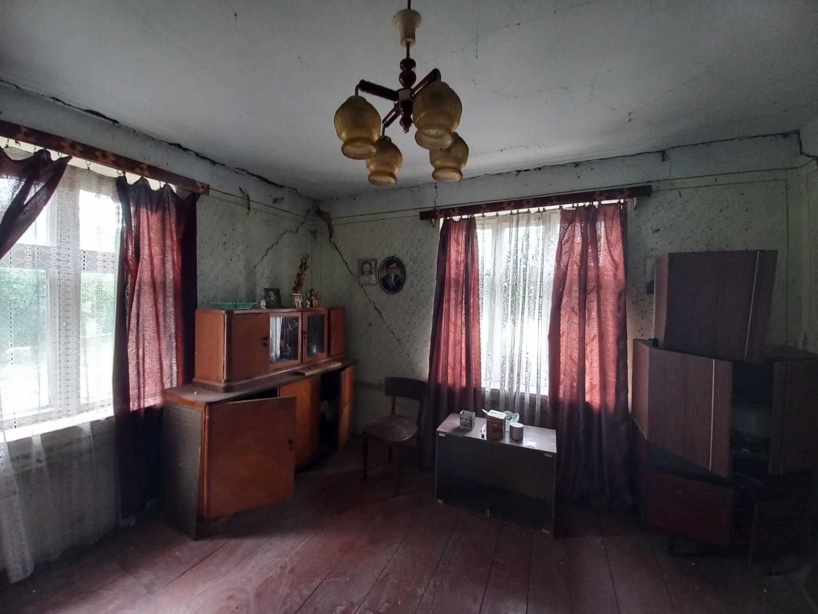 Житловий будинок та земельна ділянка 12 сот., м. Кам'янка-Бузька