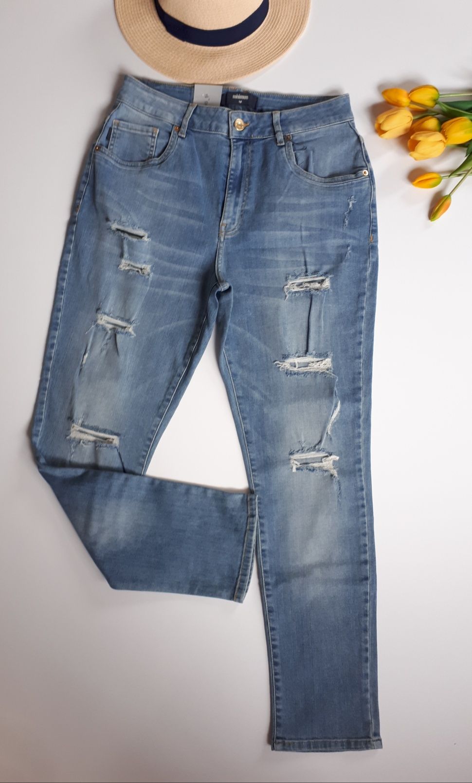 Spodnie damskie jeansowe z dziurami dziurami L