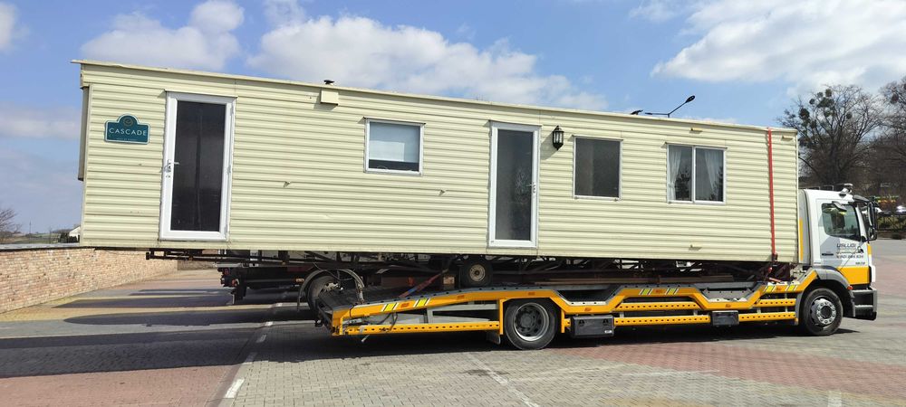 Pomoc drogowa transport maszyn  laweta autolaweta usługi transportowe