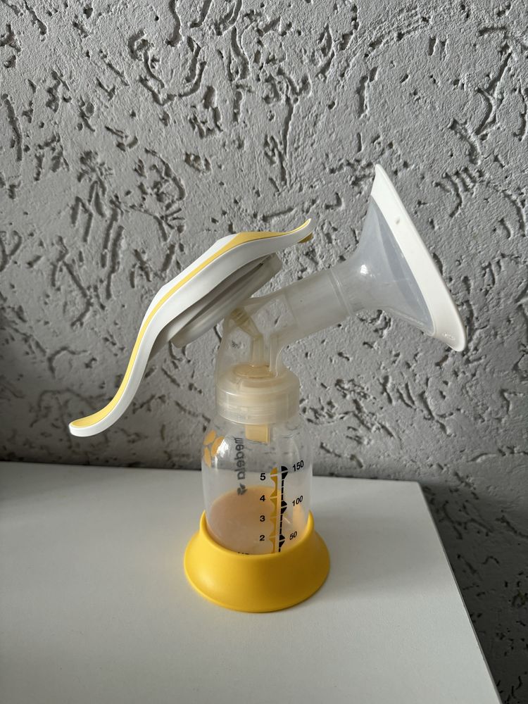 Молокосос Medela ручний + пакети для молока