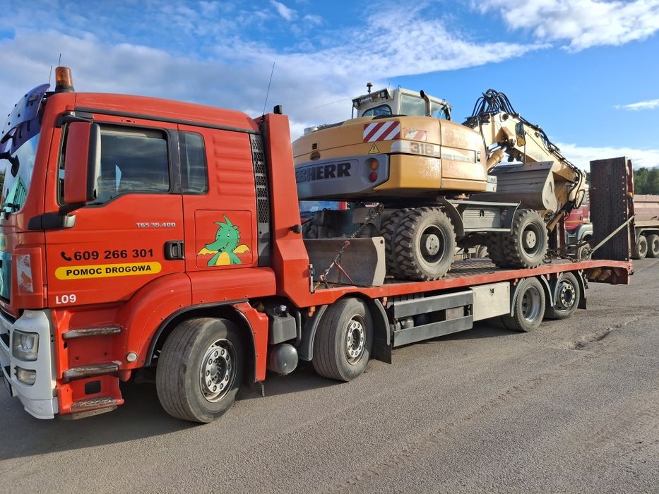 Laweta transport pomoc drogowa koparka ładowarka wozek widłowy bus