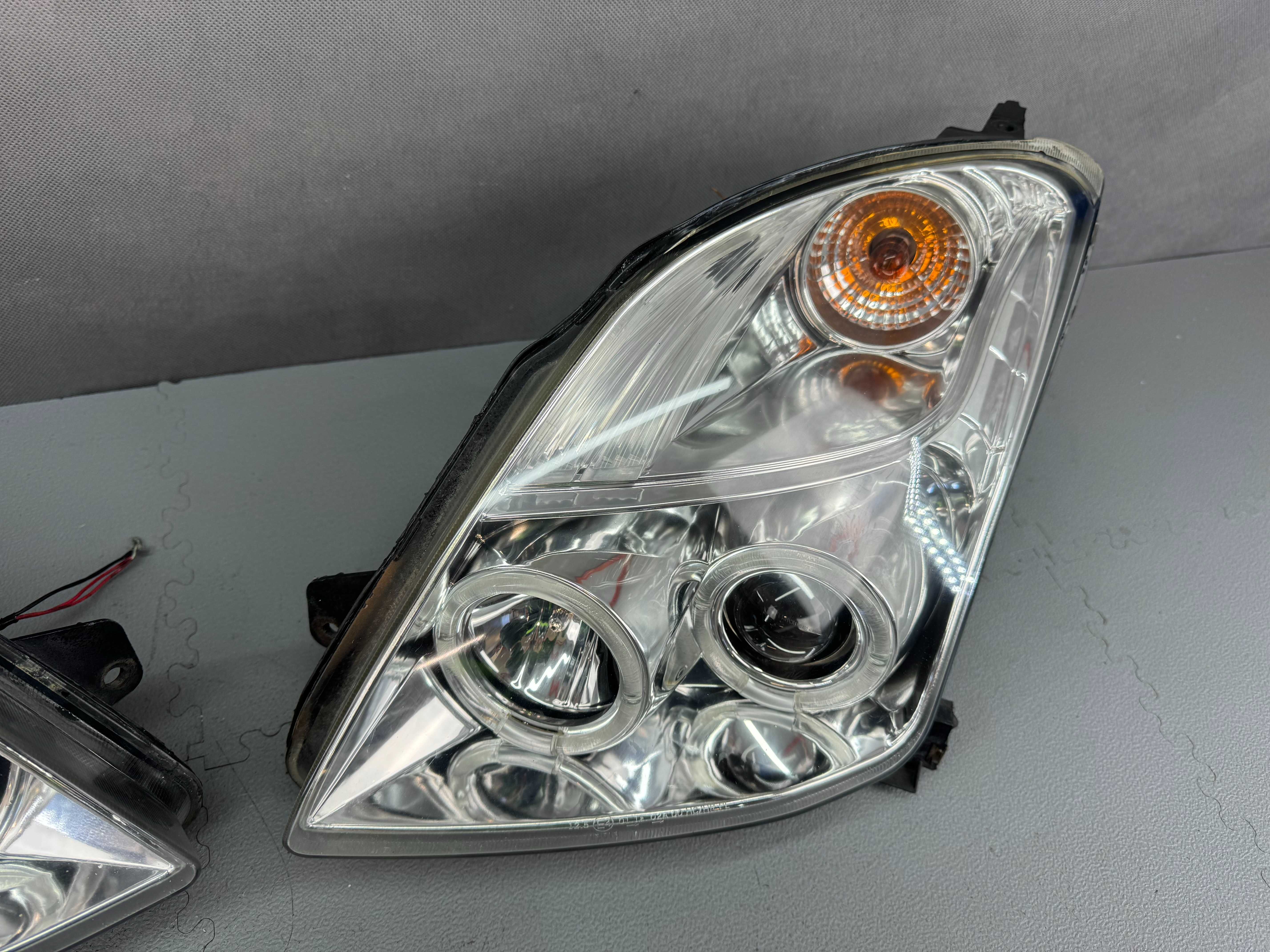 Suzuki Swift IV Lampy Przednie Lewa+Prawa Komplet Europa Ringi LED