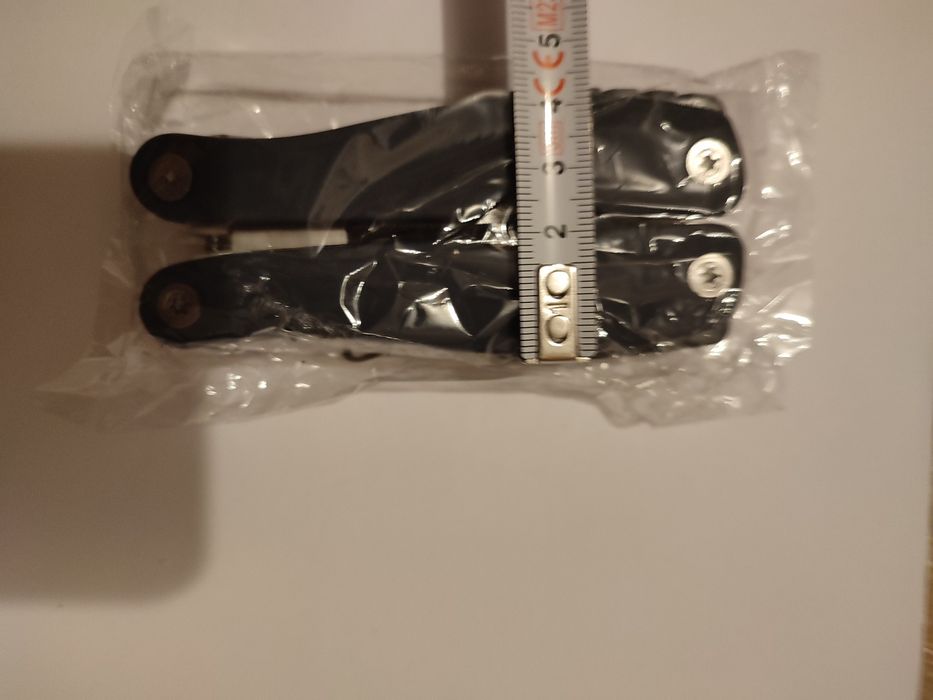 Новий мультітул, 9 в 1 , пласкогубці, кусачки, ніж , відкривачка...